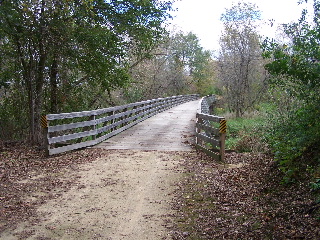 the bridge just past the steep rock walls